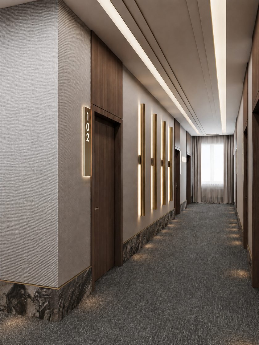 Corredor de hotel com carpete grafite e iluminação embutida